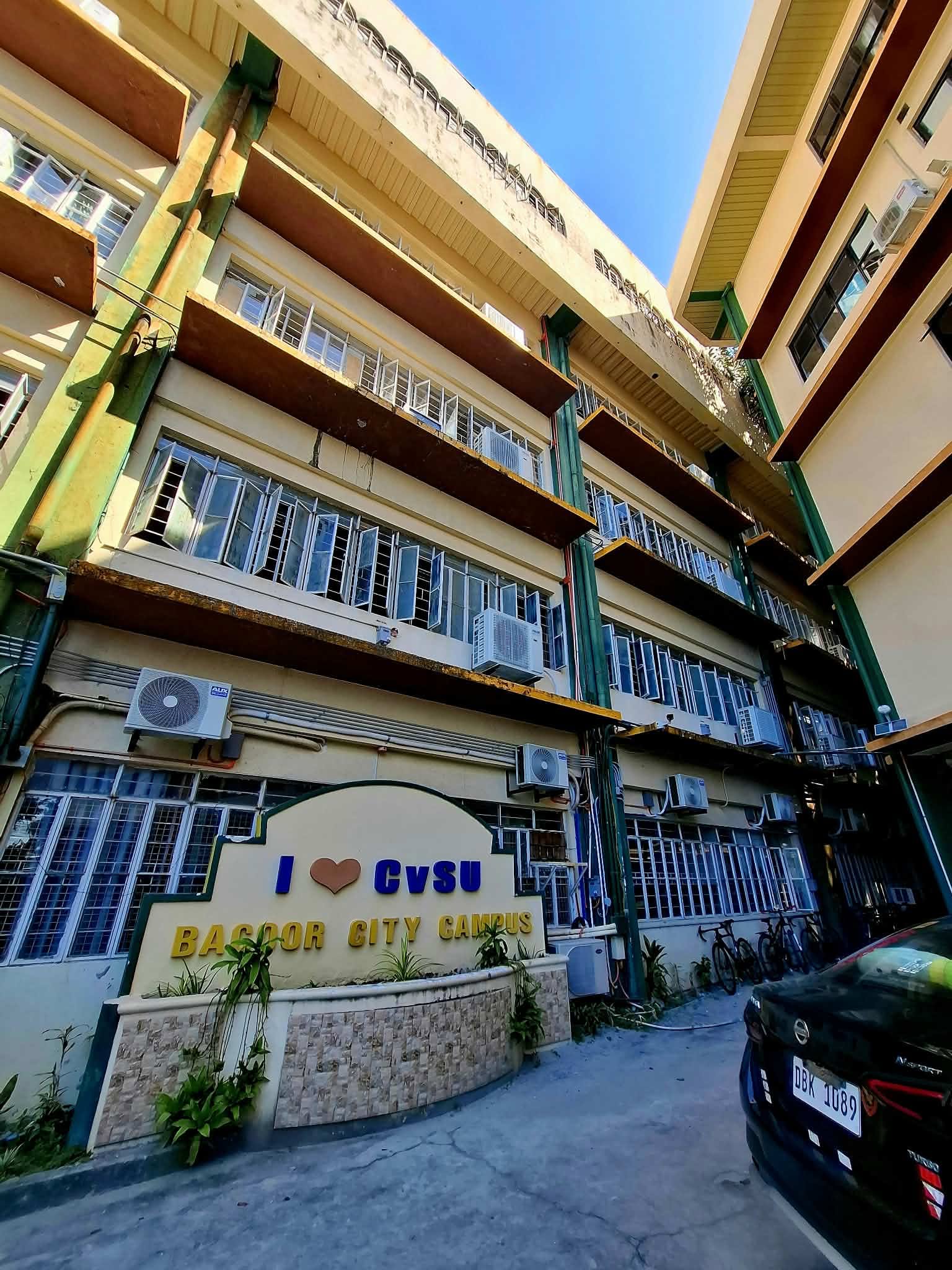 The I love CvSU Bacoor City Campus sign in front of the campus building