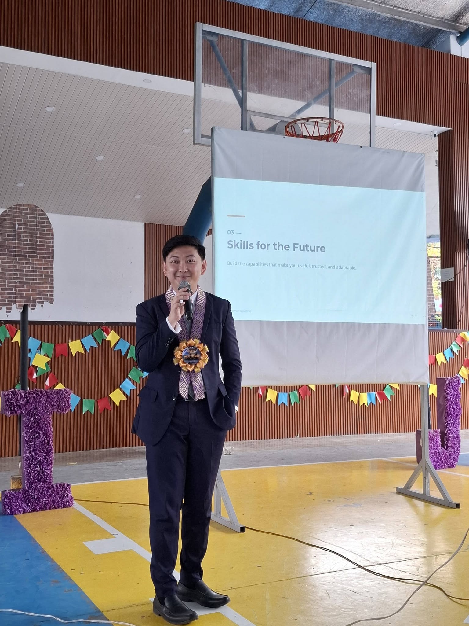 Jayson standing in front of a slide titled Skills for the Future