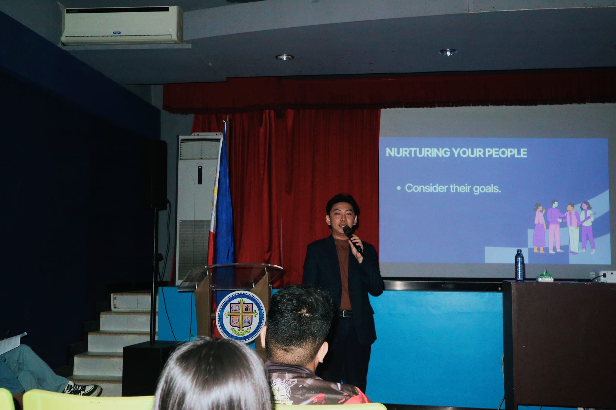 Jayson presenting a Nurturing Your People slide during the ICI College leadership seminar