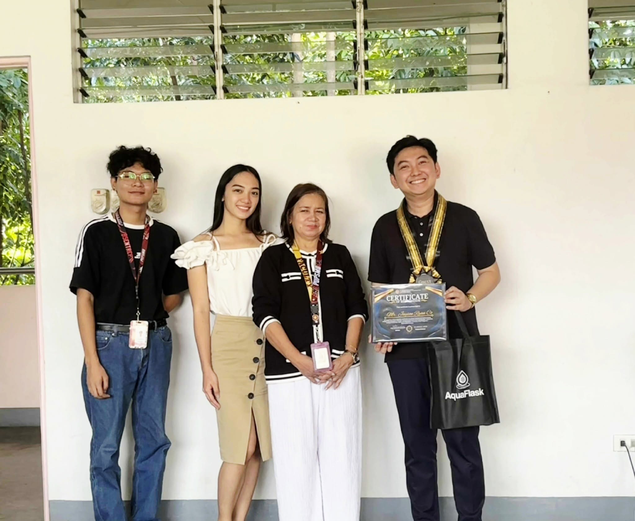 Jayson holding his certificate of recognition with PUP Santa Maria faculty and student organizers