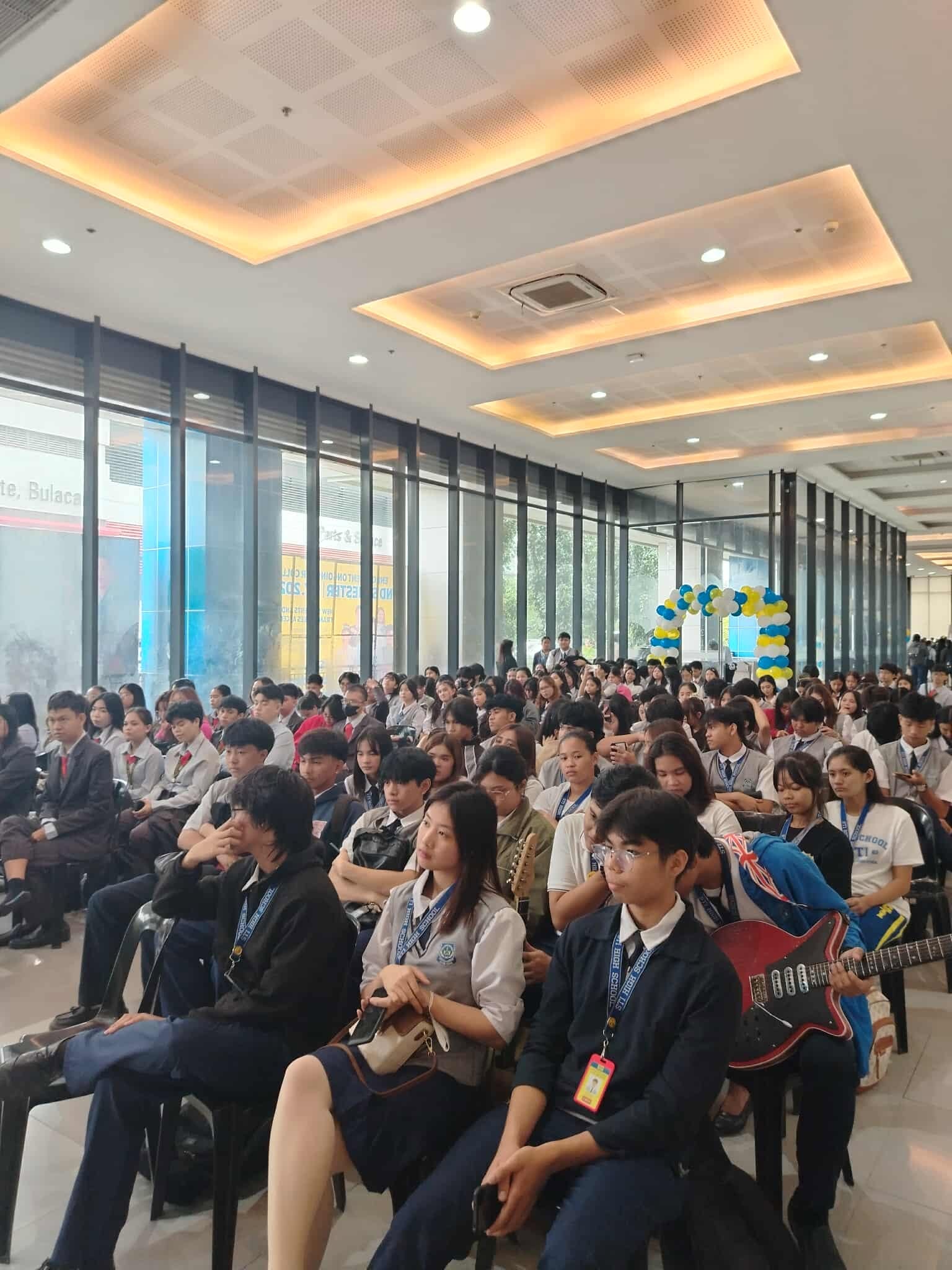 Hall full of STI San Jose del Monte students listening during Academic Week 2025
